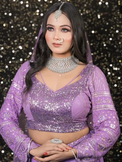 This lavender lehenga with all-over silver sequin work is a showstopper. It's perfect for a reception or cocktail event, paired here with a diamond choker.