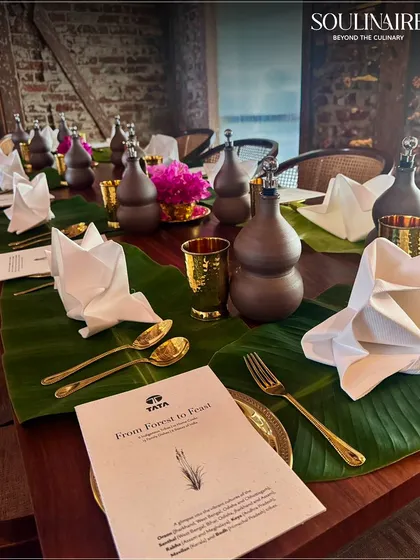 A close-up of the menu and table setting for the 'From Forest to Feast' event, highlighting our collaboration with Tata Steel Foundation. Our presentation reflects the unique story of each event.