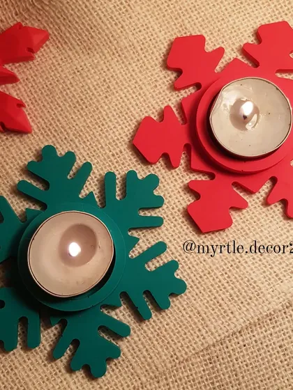 Our Snowflake T-light holders lit up and glowing. The bright red and green colors feel so merry and bright, perfectly capturing the Christmas spirit.