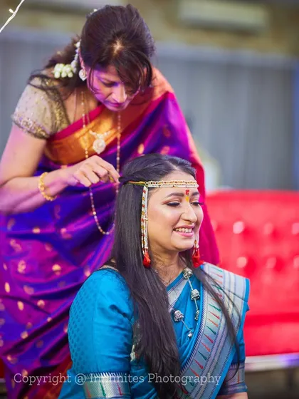The 'getting ready' moments are full of emotion. This sweet interaction between a mother and daughter as she prepares for the ceremony is a priceless memory.