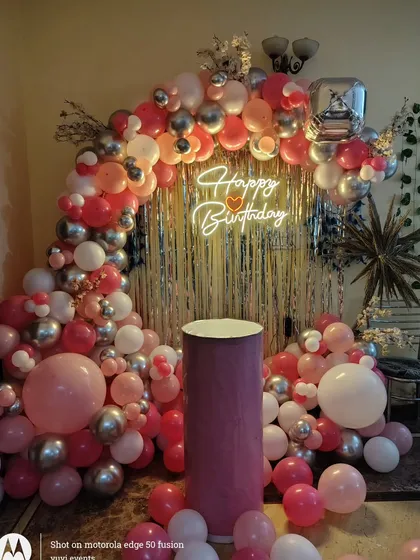 The full birthday backdrop with a gold fringe curtain, creating a warm and celebratory feel.