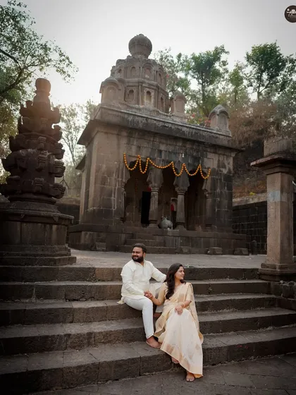 A quiet, candid moment during a traditional pre-wedding shoot at a heritage temple. I guide couples to interact naturally, capturing their connection against culturally rich and beautiful backdrops.