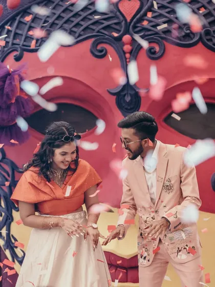 It's all about the celebration! Capturing the fun and energy of a carnival-themed party with confetti and dancing is what makes a wedding story complete.