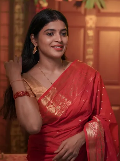 An authentic and warm portrait captured in natural light. This festive look in a classic red saree shows my ability to create images that feel both personal and professionally polished.