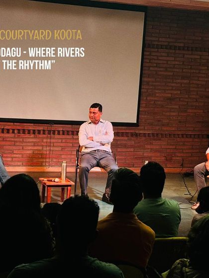 A panel discussion in progress on "Kodagu - Where Rivers Set the Rhythm." We host conversations that bring together multiple experts to discuss regional culture and ecology.