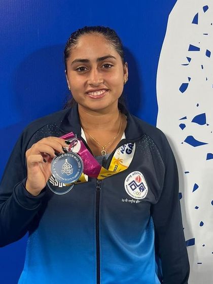 Celebrating a silver medal win for the team event at the 37th National Games in Goa. This achievement reflects our player's ability to perform under pressure in a team format.