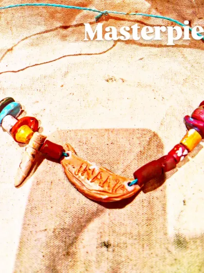 Another beautiful example of our terracotta jewelry workshop. This piece features hand-shaped beads and a central pendant, all made from clay and painted with intricate details.