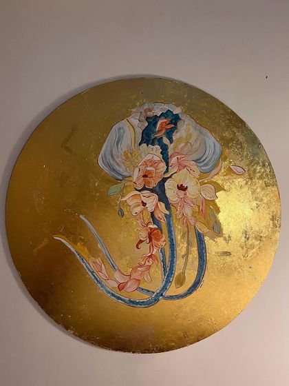 Another view of the finished floral jellyfish on its golden background. The piece is meant to evoke a sense of beauty in flow, a core concept of the project.