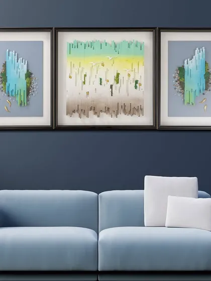 This abstract, three-panel shadow box brings the tranquility of a natural landscape into your home. The use of greens, blues, and earthy tones with 3D elements evokes a sense of peace and nature.
