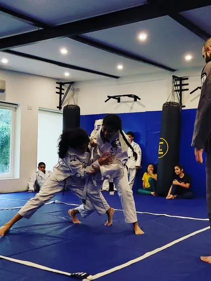 This is our kids' Jiu-Jitsu and grappling class in action. I'm teaching them how to use technique and leverage, not just strength. It's about control and thinking two steps ahead.