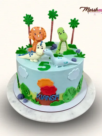 A roarsome treat for a 5th birthday! This dino-themed cake is a delicious combination of salted caramel and chocolate, topped with four friendly, handmade, and completely edible dinosaurs.