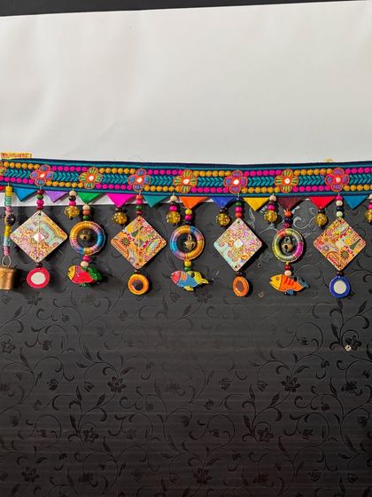 The full 3-foot length of 'The Summer Song' toran, a piece that sings with color and playful elements like fish and mirrors.