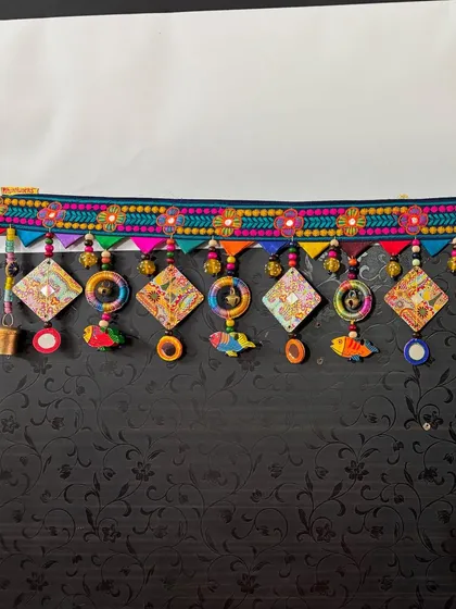 The full 3-foot length of 'The Summer Song' toran, a piece that sings with color and playful elements like fish and mirrors.