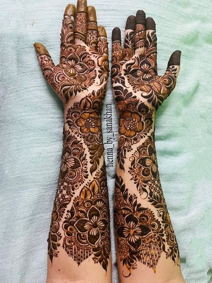 Another angle of the flowing floral vine design, showcasing the beautiful symmetry and detail that covers both arms.