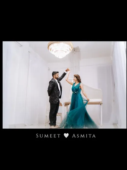 A playful dance in an elegant, all-white room with a grand piano and chandelier. This pre-wedding shot is full of movement and joy, capturing the couple's fun-loving spirit.