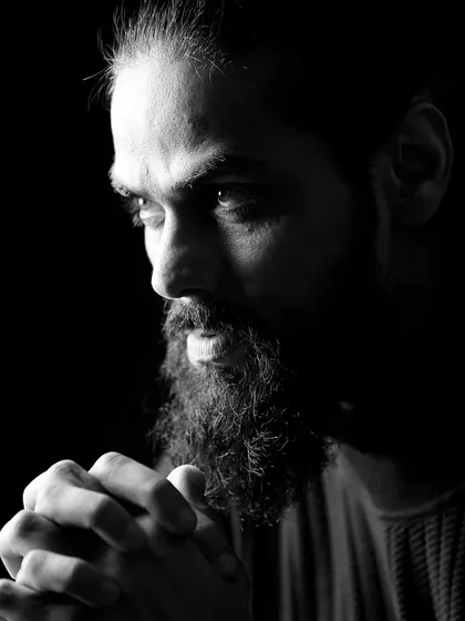 A contemplative, thoughtful pose from Arpit Ranka. Even in a quiet moment, the lighting maintains the dramatic and cinematic feel of his portfolio.