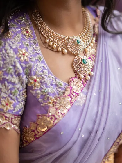 The magic is in the details. This is a close-up of a hand-embroidered blouse for a lilac Langa Dhavani, featuring delicate zardosi, beadwork, and floral motifs that bring the entire outfit to life. I believe the blouse is the heart of the ensemble.