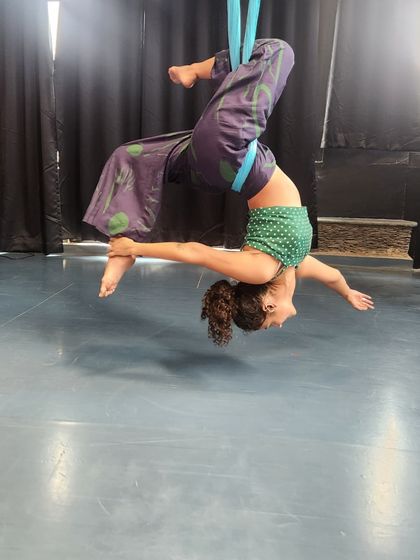 The feeling of floating in an aerial hammock is pure happiness. This inverted pose allows for a deep release, letting gravity do the work as you simply hang and breathe.