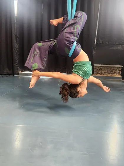 The feeling of floating in an aerial hammock is pure happiness. This inverted pose allows for a deep release, letting gravity do the work as you simply hang and breathe.