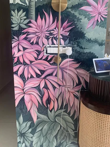 The lower section of the mural demonstrates the flow of the composition. We use layers of leaves and varying shades of green and pink to create a realistic sense of depth.