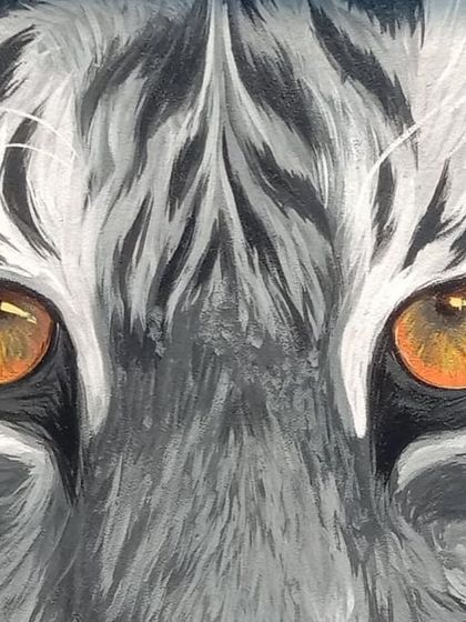 An intense close up on the tiger's eyes. I aimed to make them the focal point of the mural, capturing a lifelike glint that seems to follow you, showcasing the power of hyperrealistic animal portraiture.
