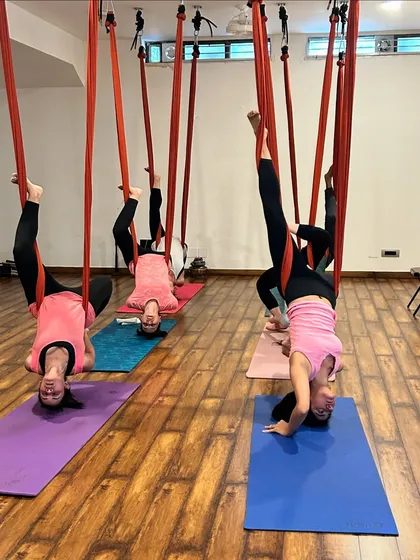 Another view of our aerial inversion class, highlighting the supportive and encouraging atmosphere of the studio.