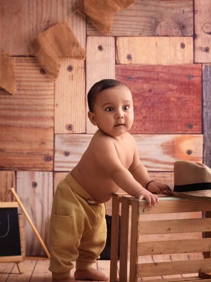 Standing tall and looking right at the camera, this little cowboy is the star of his own western adventure.