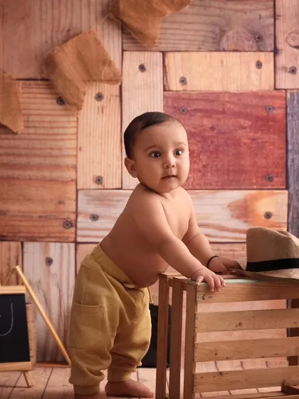Standing tall and looking right at the camera, this little cowboy is the star of his own western adventure.