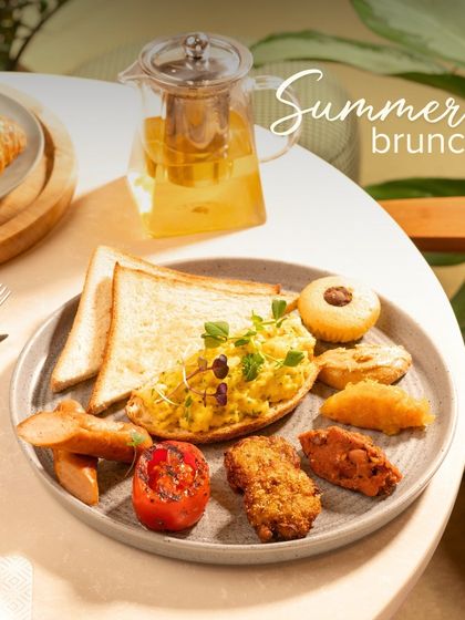 A summer brunch spread featuring our Vegan Akuri. This Parsi-style scrambled tofu is served with toast, hash browns, and grilled tomato.