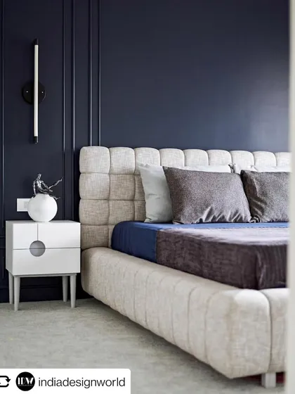 A shot of the guest bedroom from our feature in India Design World. The deep blue walls and plush headboard create a serene and luxurious retreat.
