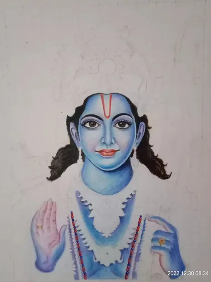 A work-in-progress shot of a color pencil portrait of Lord Rama. This image shows the early stages of applying color to the face and building up the layers.