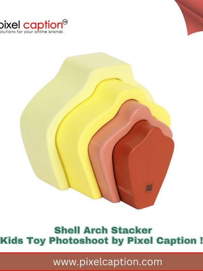 A branded image of a shell arch stacker toy, perfect for use in online advertising and social media marketing.