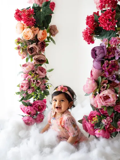 Another joyful expression from a floral swing session. The combination of flowers and fluffy clouds is just magical.