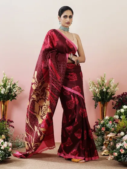 The full view of the maroon floral saree, showcasing its dramatic print and elegant drape.
