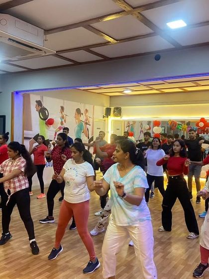 A candid moment from our Christmas 2022 fitness party. You can see the focus and fun on everyone's faces as they follow the choreography.