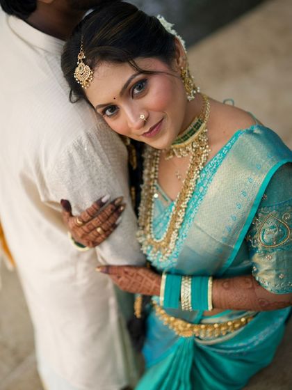 An intimate couple portrait. The bride looks stunning, and her traditional look is a beautiful contrast to the groom's simple white attire.