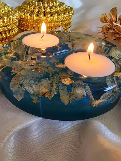 Sold. Shipping this beauty to Kolkata. A teal resin tealight holder with gold leaf, ready for its new home.
