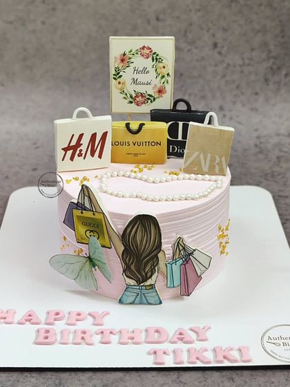 A cake for a shopaholic! This design is topped with edible miniature shopping bags from brands like Louis Vuitton, Gucci, H&M, and Dior.