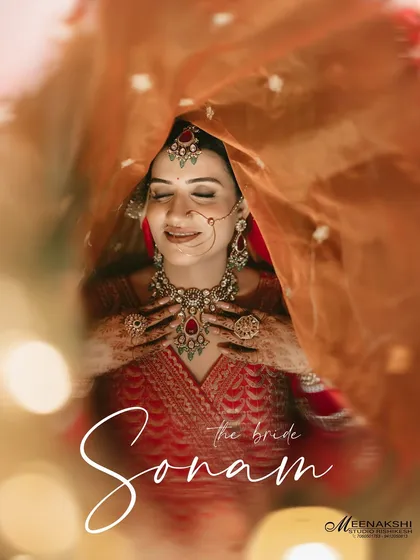 A beautiful bridal portrait with the bride looking down, her face softly illuminated under her veil. This shot has a timeless, classic feel, full of grace and anticipation.