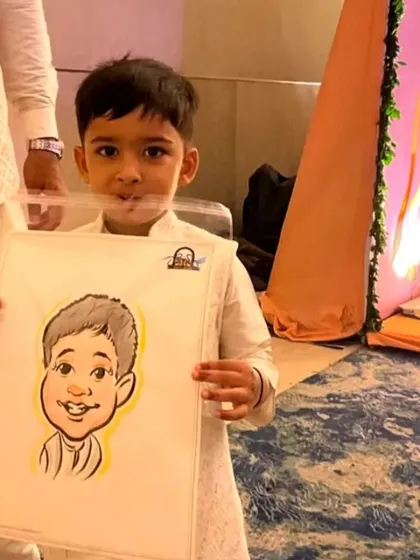 This little guy proudly showing off his new caricature is a perfect example of the fun party favors I provide. My drawings are a hit with kids at birthday parties and family functions.