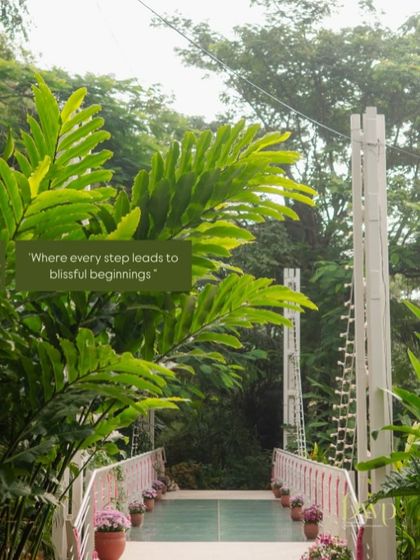 "Where every step leads to blissful beginnings." We adorned this beautiful bridge with simple floral arrangements, turning it into a symbolic and picturesque pathway for the wedding guests.