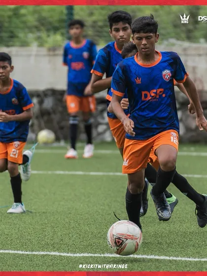 A player on the ball, driving forward. We encourage our players to be confident and take initiative.