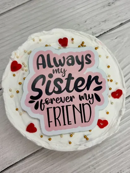 A Rakhi bento cake for a sister, reading 'Always my sister, forever my friend'.