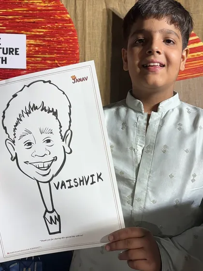 A young guest proudly shows off his black and white caricature at a party. I can add names to make each drawing extra special.