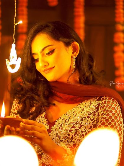 Another beautiful Diwali look. The winged eyeliner and soft makeup are perfect for an evening of celebration, lit by the warm glow of diyas.