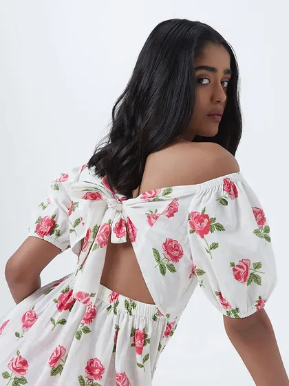 A commercial fashion look for Westside. The makeup is clean and the hair is styled in simple, soft waves to complement the pretty, floral dress with a back bow detail.