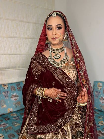 A regal bridal look that feels as unique as you are. This bride is adorned in a beautiful maroon velvet shawl, with makeup that features bold eyes and a perfectly balanced, glowing complexion.