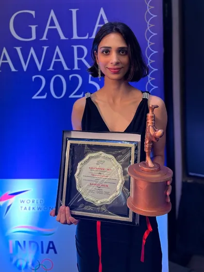 Kashish Malik, who co-hosted the Gala Awards, holding her plaque. She is a champion both on and off the mat.