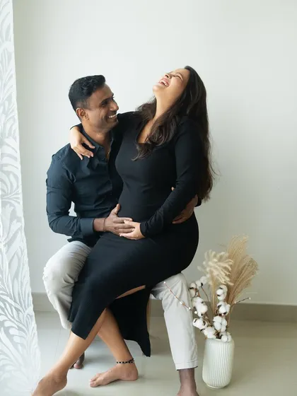 The best moments are often the unscripted ones. This candid shot captures pure, uninhibited laughter and joy between a couple during a relaxed lifestyle session, showing that these photoshoots are all about being yourselves.