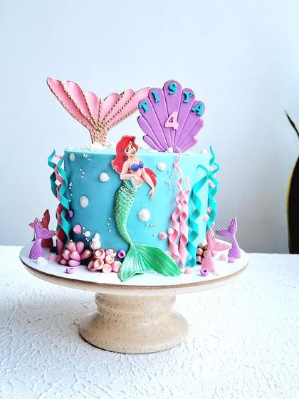 A full view of the Little Mermaid cake on its stand.